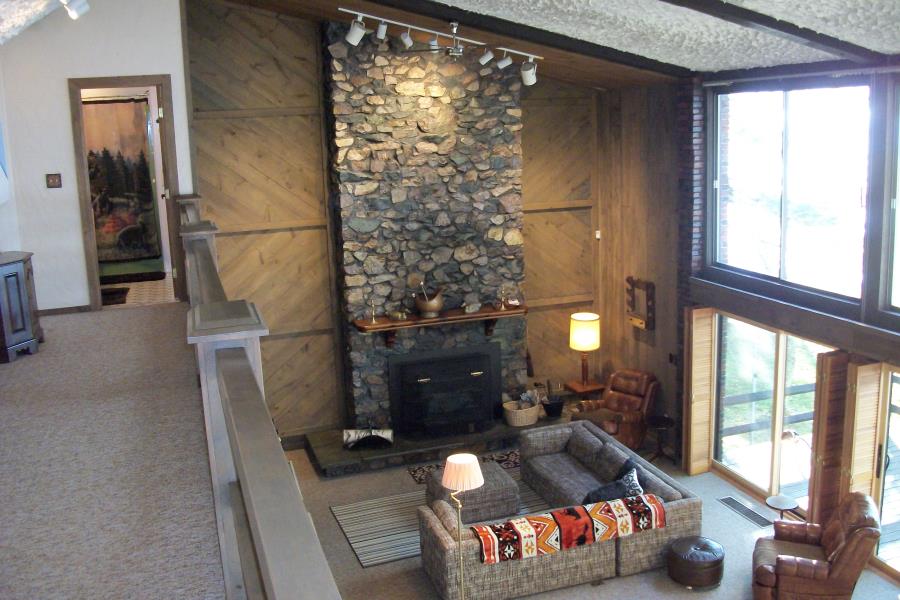 Great room fireplace viewed from the balcony